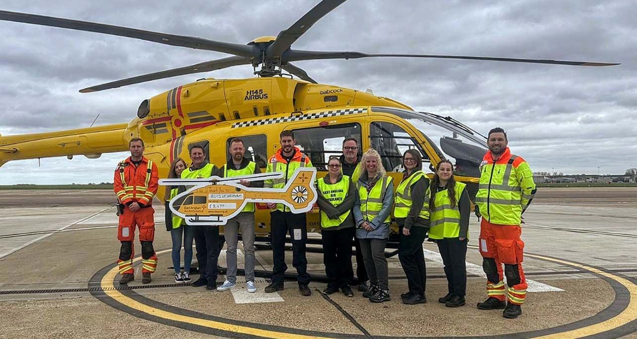 Roys Staff present cheque to East Anglian Air Ambulance